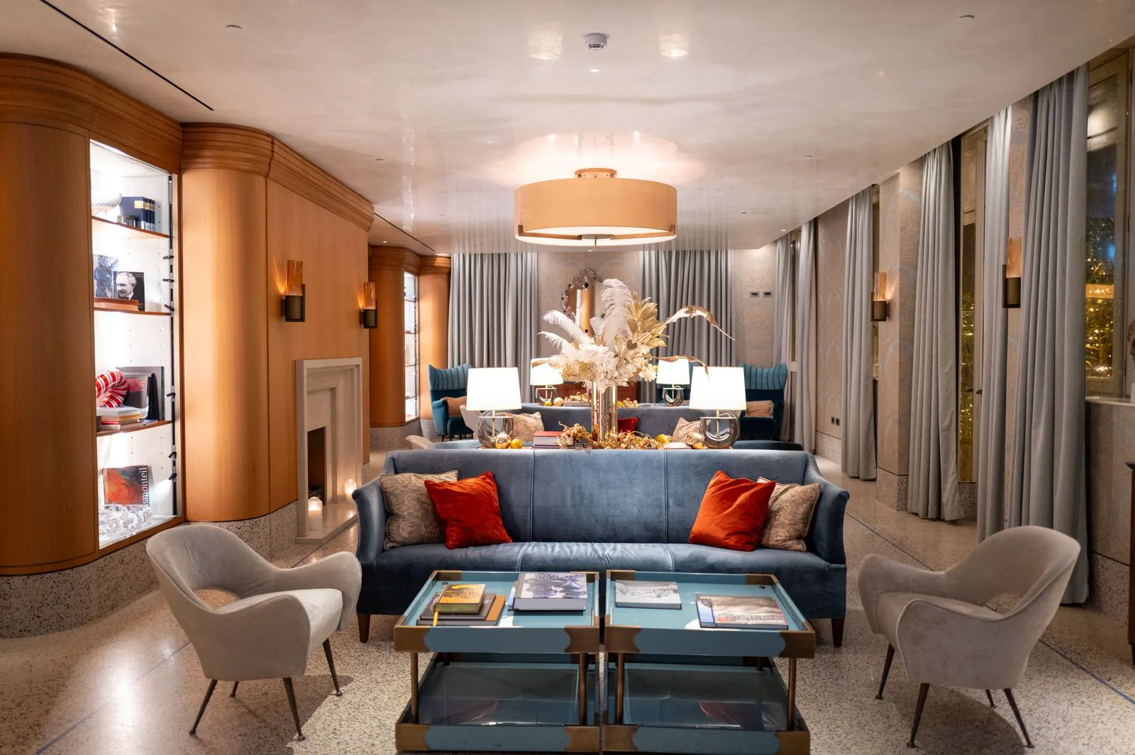 Lounge and seating area with panelled walls, a low console and accent lighting