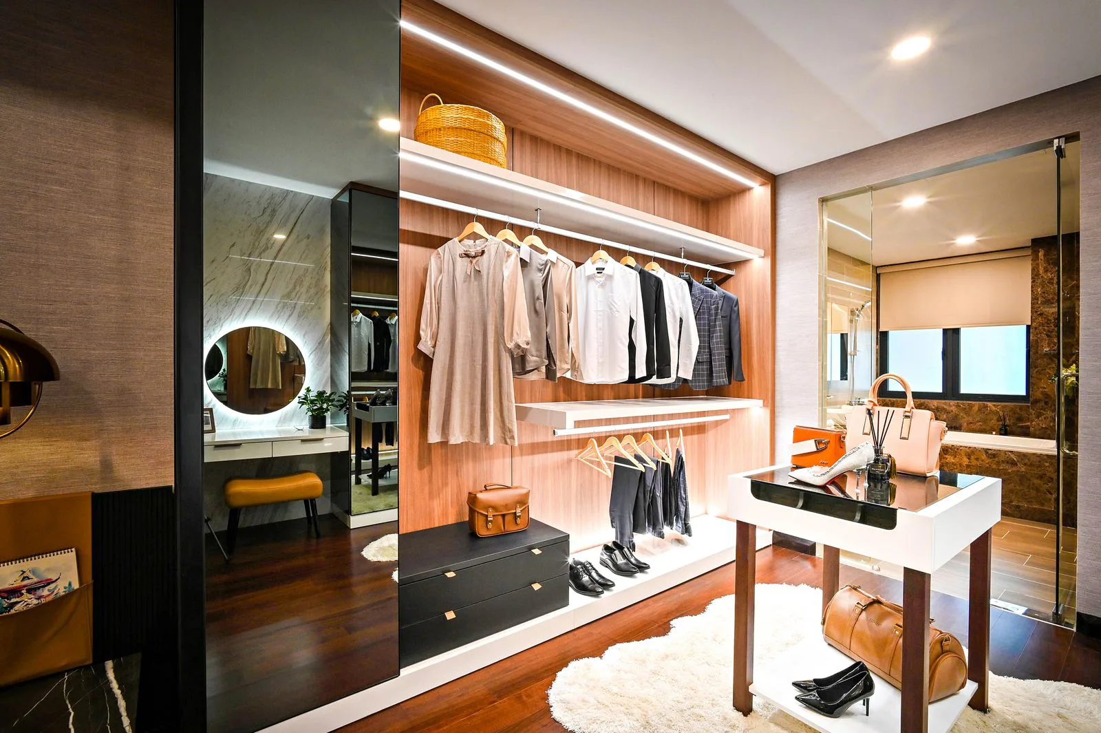 Walk-in wardrobe in an Ahmedabad home finished in veneer with branded soft-close hardware