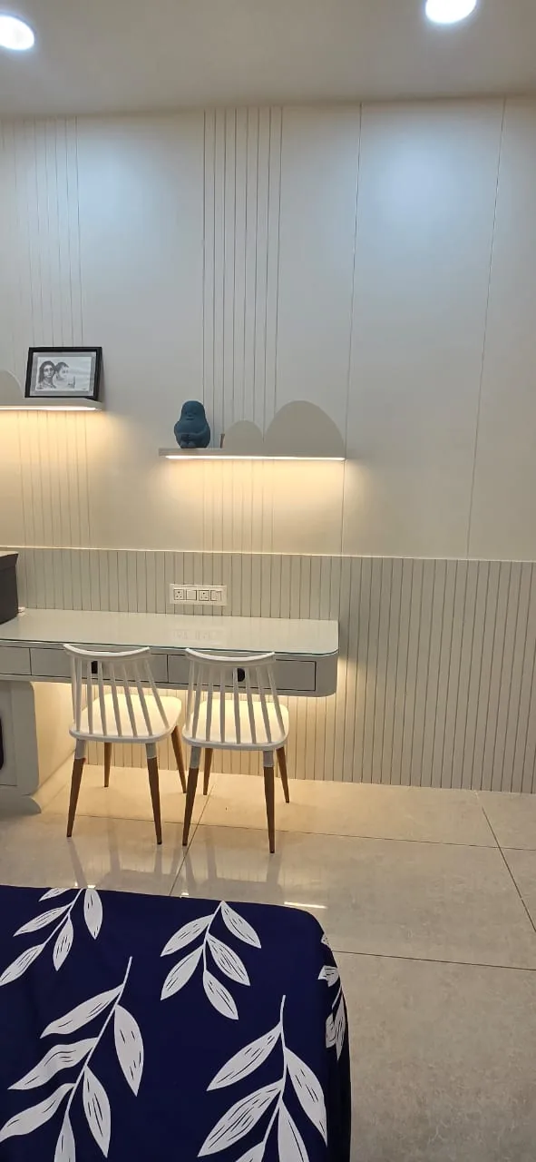 Study desk for two with cloud-shaped shelves on lit profiles above a grooved dado